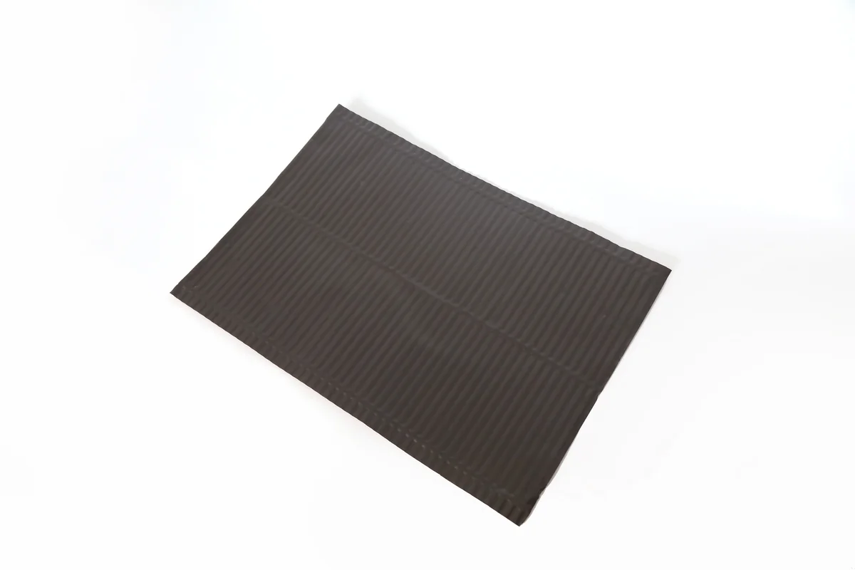 Dark textured aluminum valley flashing for a Lumina Slate solar roof.