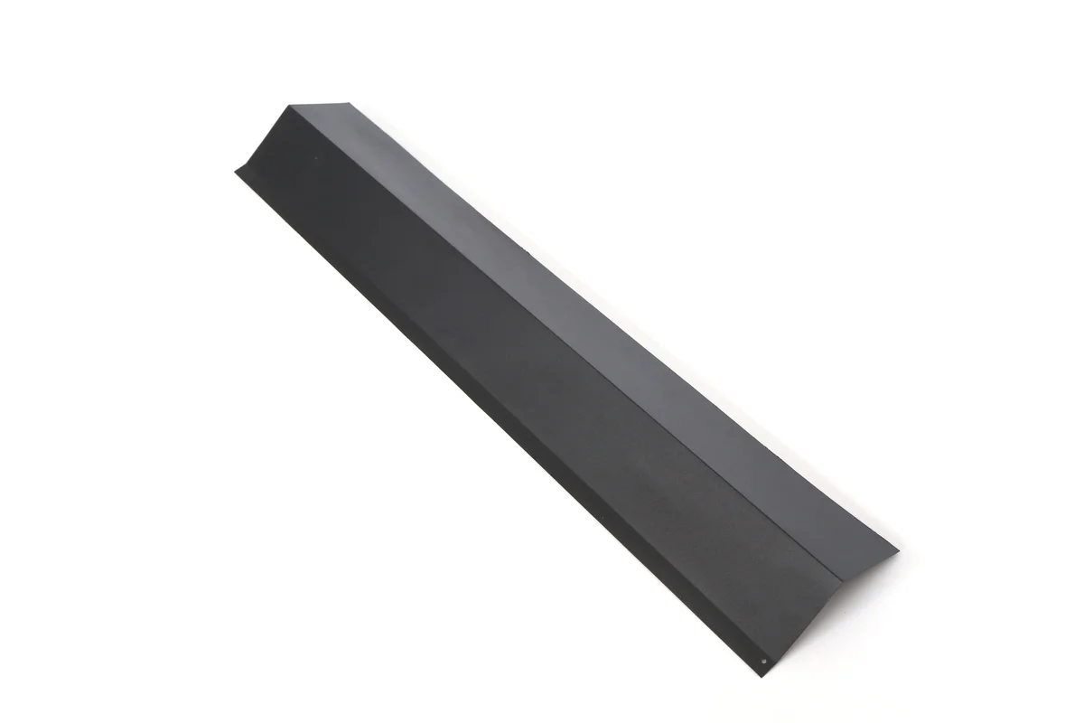 Dark metal eaves starter and drip-edge trim for a Lumina Slate solar roof.