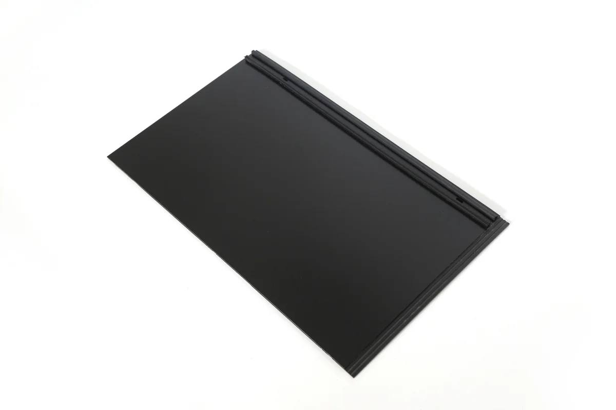 Cuttable black inactive half tile for fitting a Lumina Slate solar roof layout.