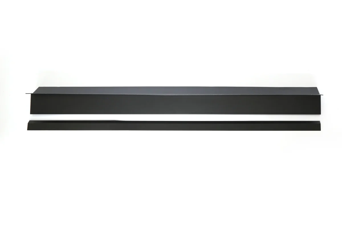 Black metal eaves starter and drip-edge strips for a Storm Guard solar roof.