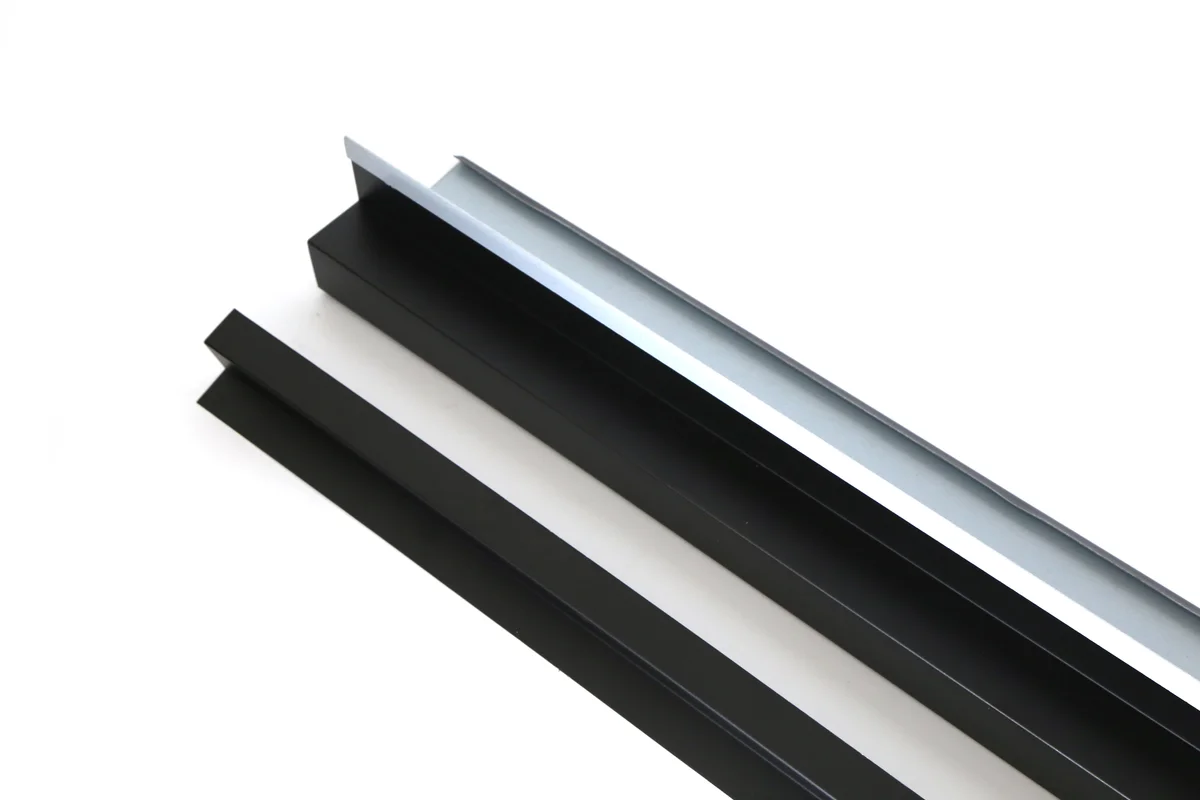 Black metal gable trim panels for finishing a Storm Guard solar roof edge.