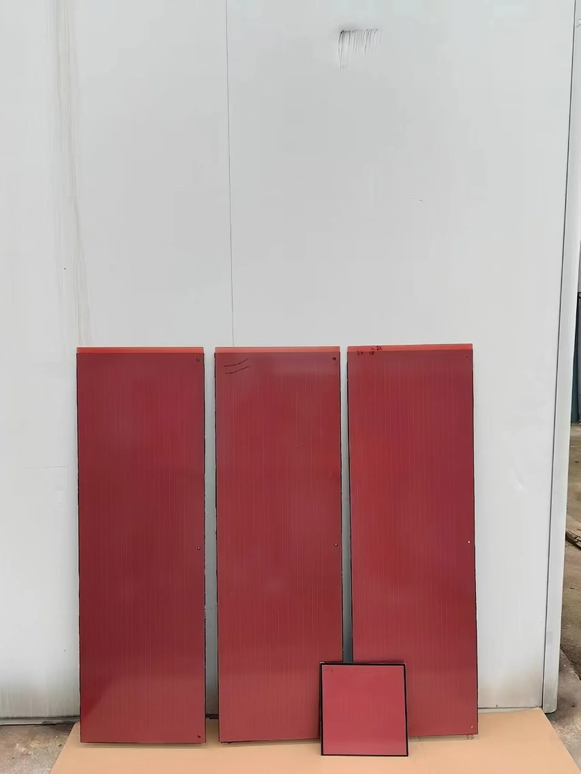 Close-up view of the custom terracotta-colored solar panels and matching non-active tiles designed for heritage roofs.