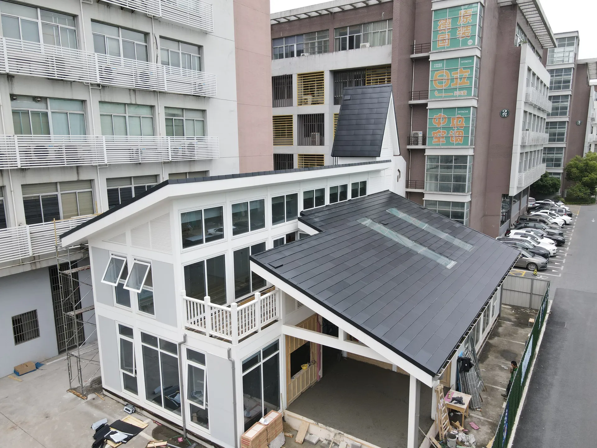 Aerial perspective of the Hangzhou eco-friendly tech building featuring a comprehensive BIPV solar roof.