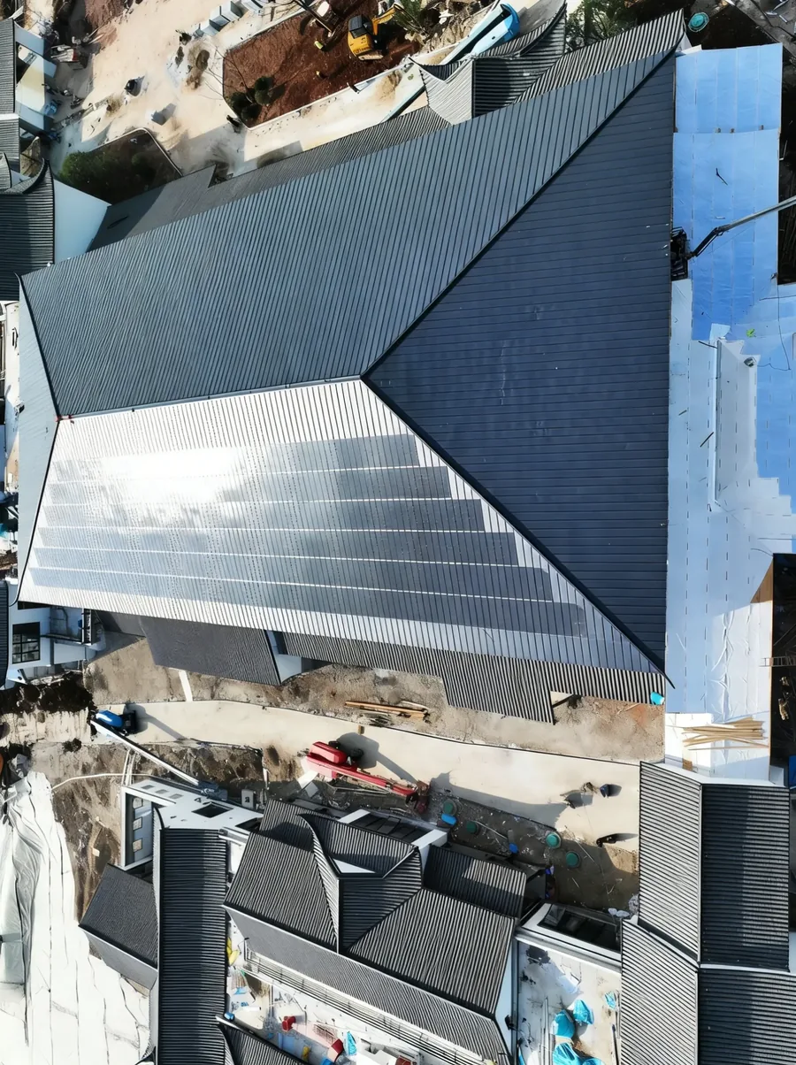 High-angle view showcasing the extensive coverage and impact-resistant design of the Storm Guard commercial solar roof.