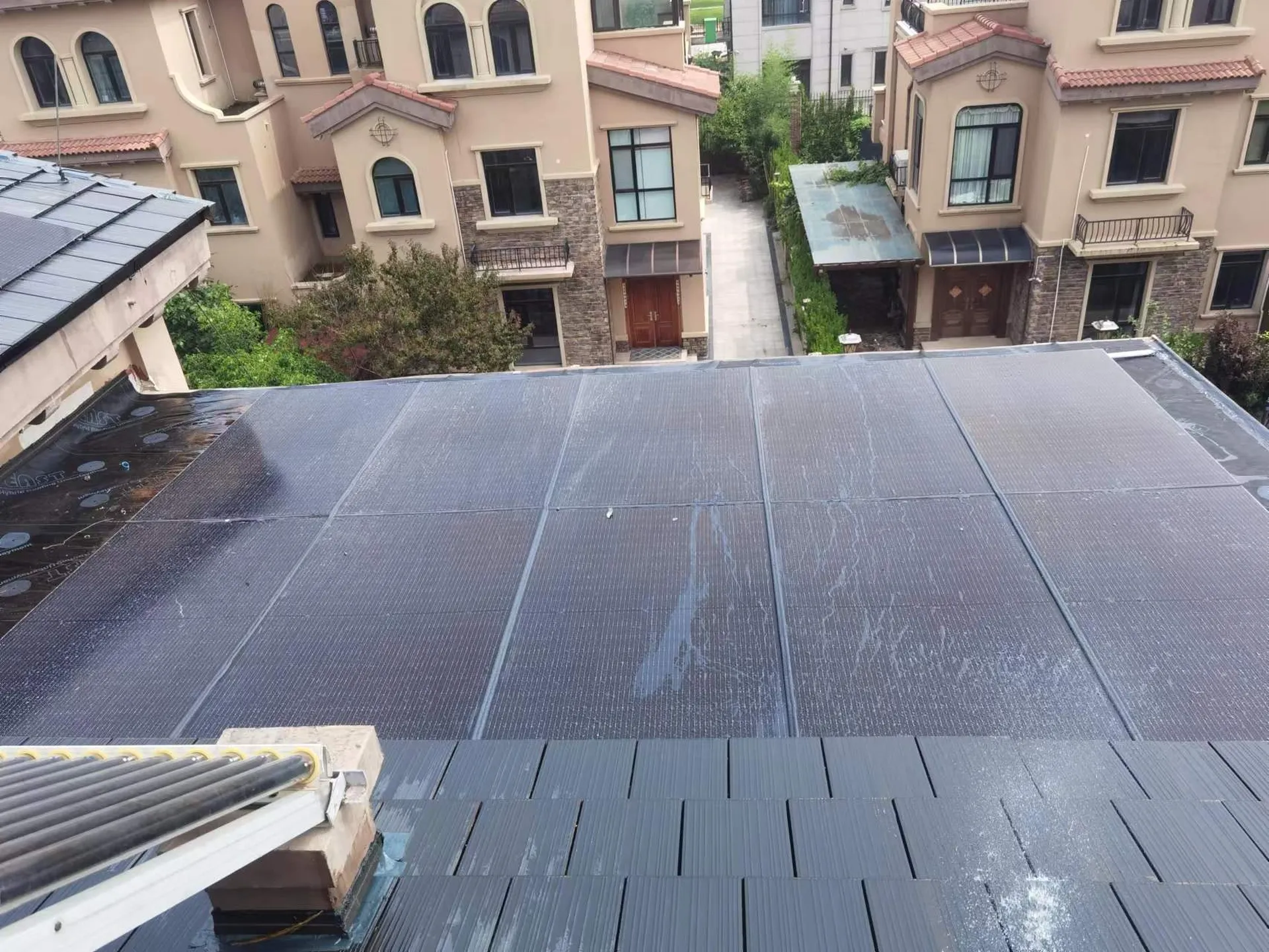 Aerial view of the residential solar roof undergoing rigorous real-world water shedding and durability tests.