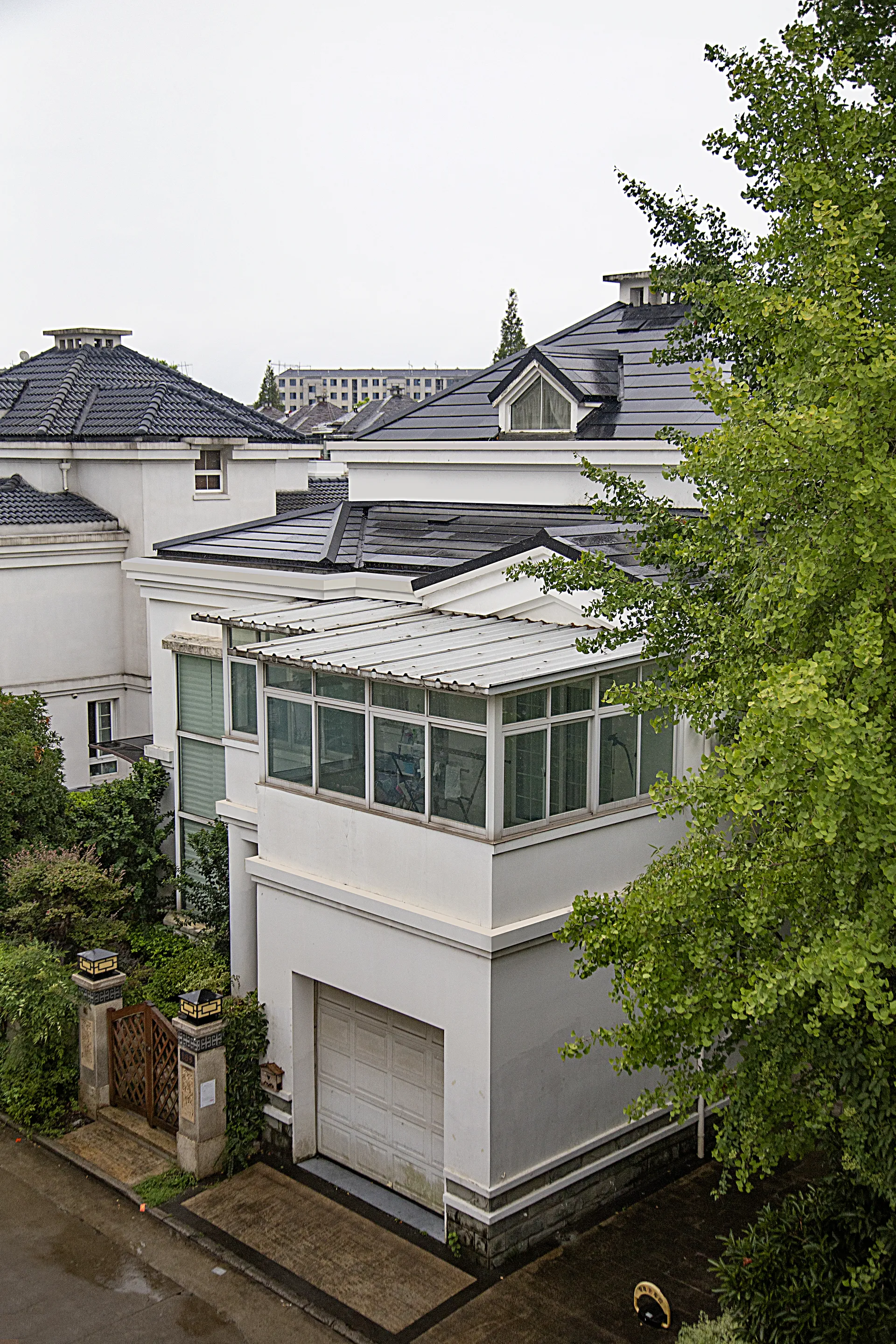 Shanghai villa with a dark solar roof installed as a residential upgrade.