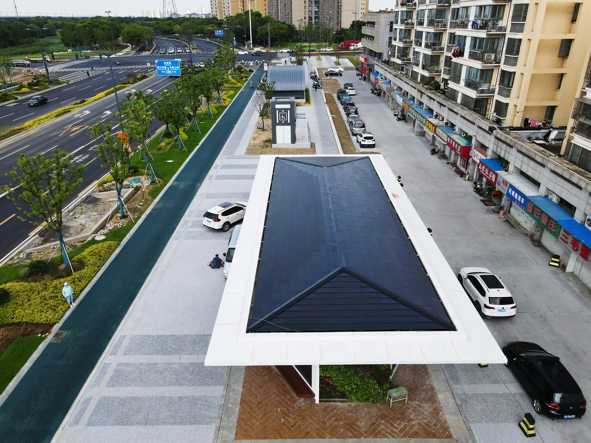 Aerial view of a modern urban relay station in Suzhou featuring a clean, integrated Sunlit BIPV solar roof.