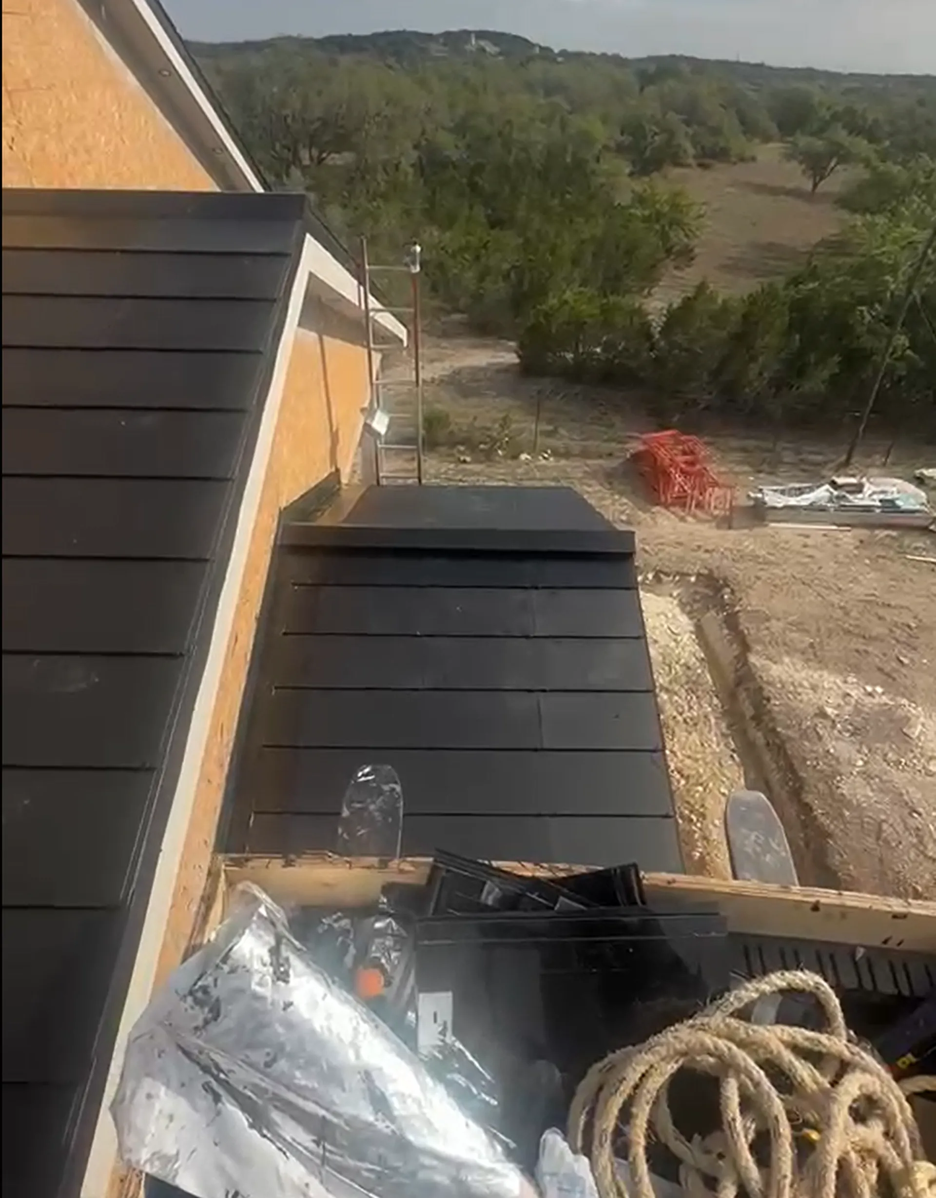 Complete architectural facade view showcasing the uniform, premium aesthetic of the invisible solar slate roofing.