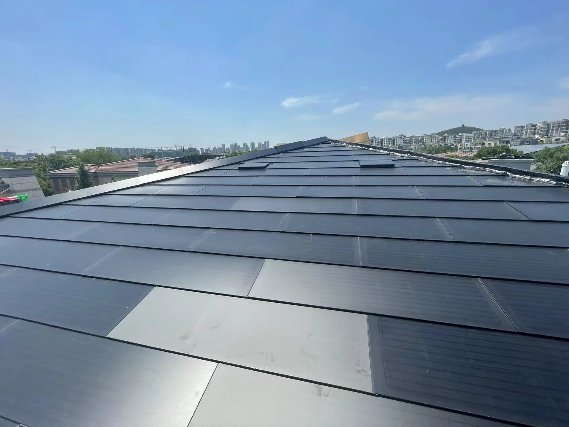 Sleek, flush-mounted design of the Sunlit solar tiles delivering a clean, modern architectural aesthetic.