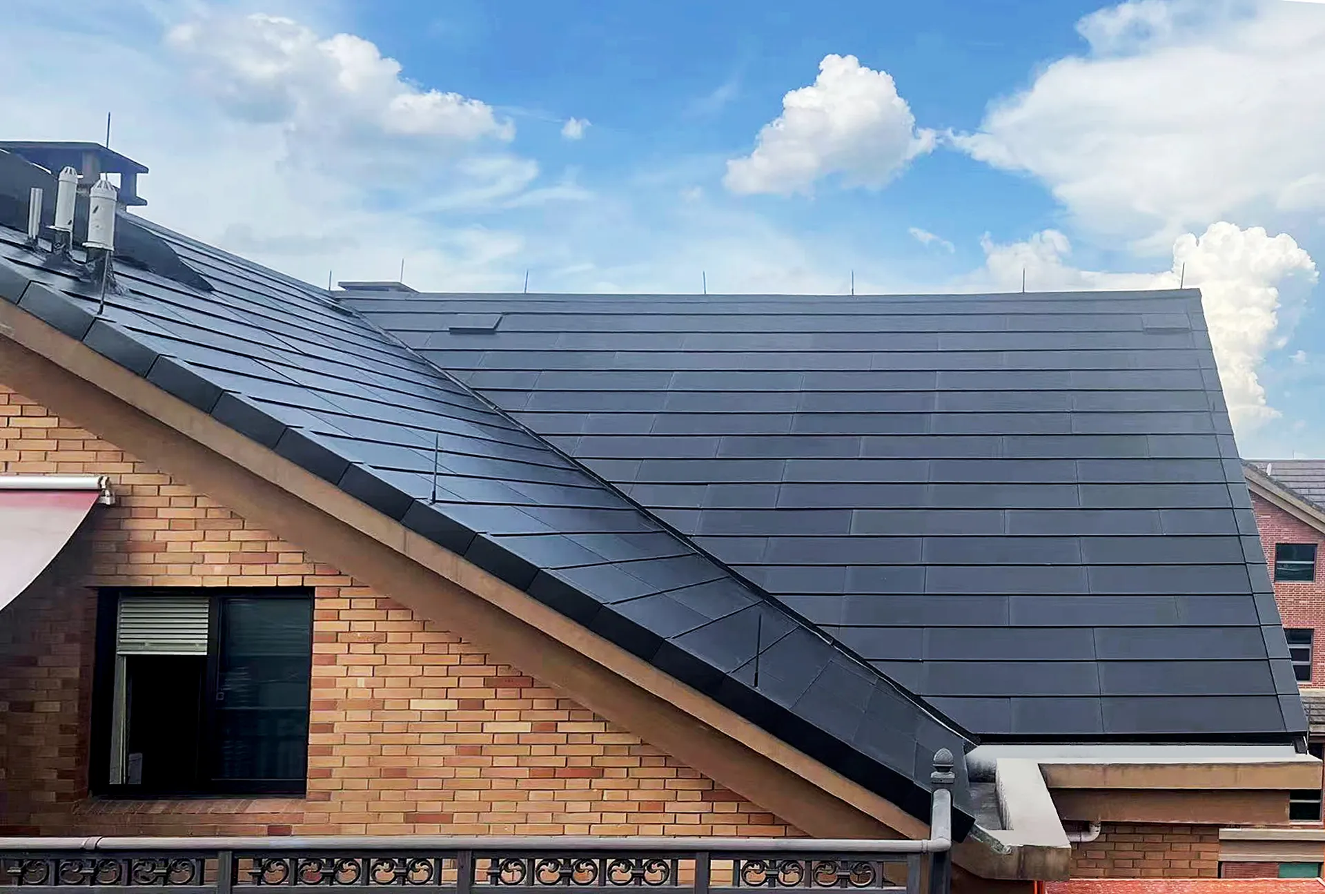Modern Sunlit BIPV solar roof seamlessly integrated with a classic brick villa facade in Yiwu, maximizing energy output.